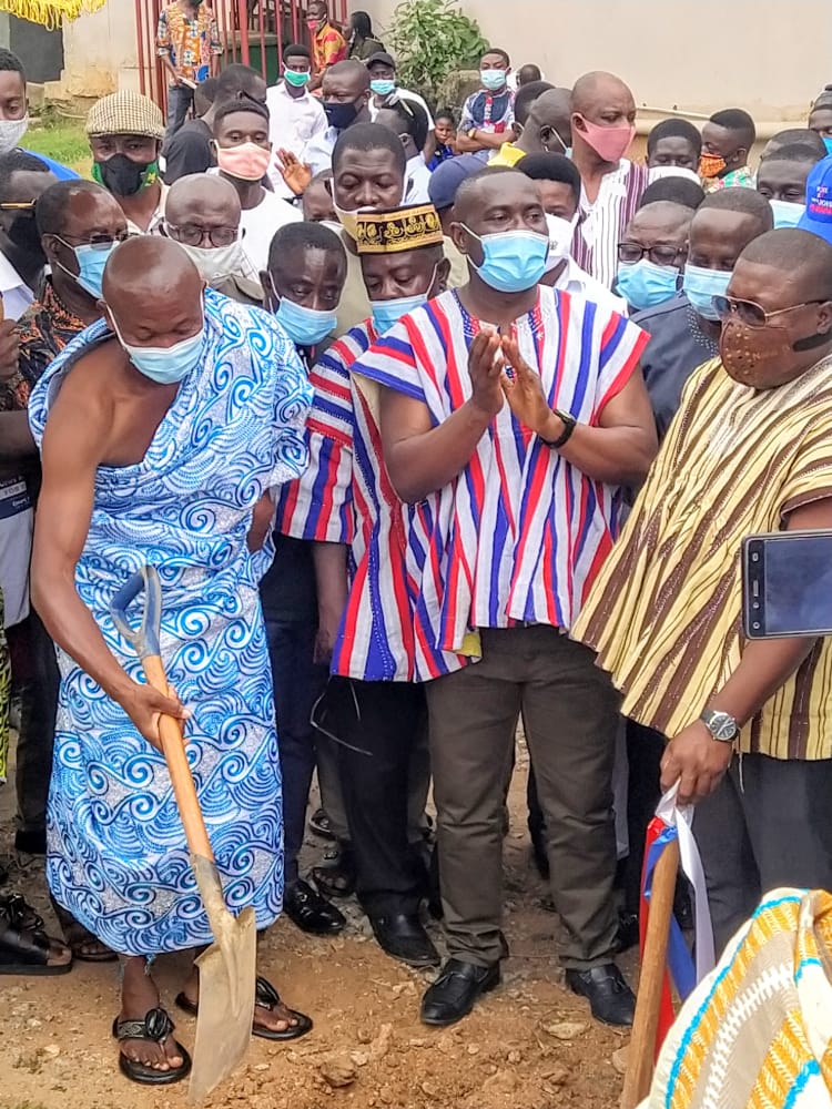 John Kumah, supported by others cut sod for construction of ...